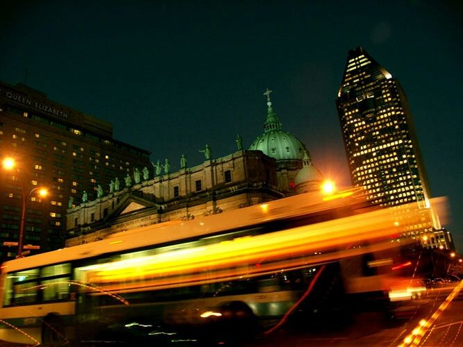 illuminated, architecture, transportation, built structure, night, city, building exterior, long exposure, travel destinations, light trail, international landmark, famous place, travel, motion, capital cities, car, traffic, speed, land vehicle, blurred motion