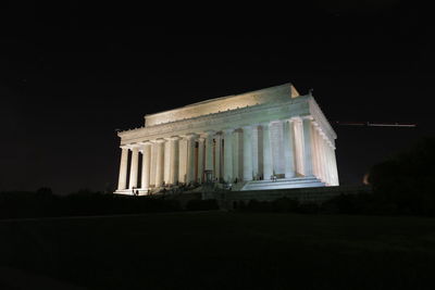 Low angle view of historical building against sky at night