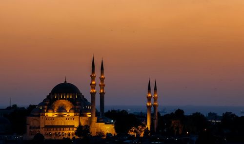 Sultan ahmed mosque against sky in city at dusk