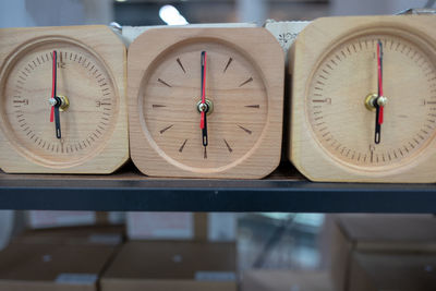 Close-up of clocks on table