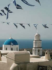 Birds flying against sky