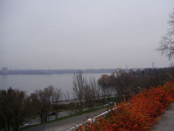 Scenic view of river against sky during autumn