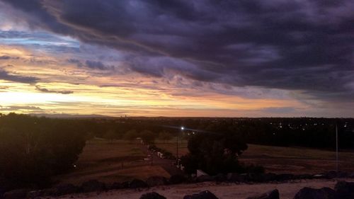 Scenic view of dramatic sky over land