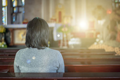 Rear view of woman at home