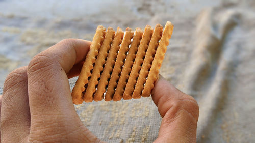 Close-up of hand holding bread