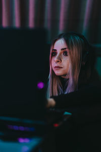 Portrait of young woman looking away