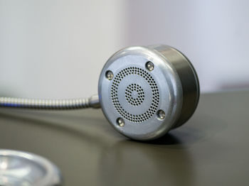 Close-up of telephone booth on table