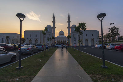 View of street amidst buildings against sky