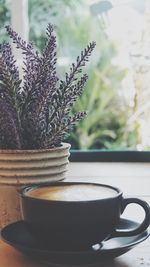 Close-up of coffee cup on table