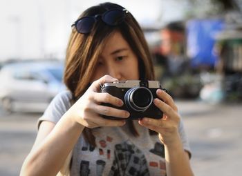 Close-up of woman photographing