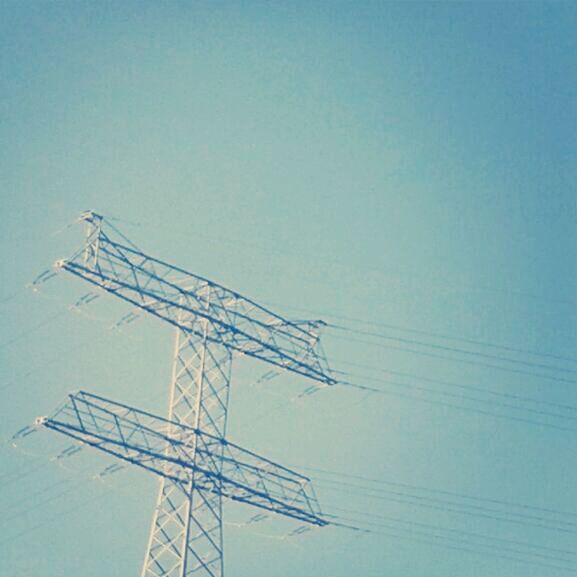 electricity pylon, power line, electricity, low angle view, power supply, fuel and power generation, clear sky, technology, connection, blue, copy space, cable, sky, outdoors, day, no people, built structure, power cable, nature, electricity tower