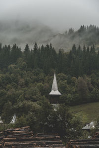Church in the middle of the forest on a foggy day