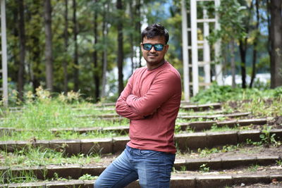 Portrait of young man standing outdoors