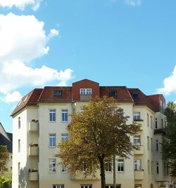 Buildings against blue sky and clouds