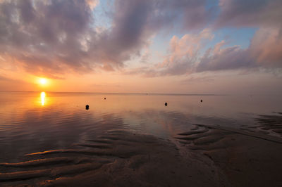 Scenic view of sea against sky during sunrise at sanur bali