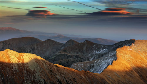 Scenic view of mountains against sky during sunset