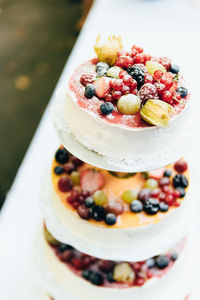 High angle view of fruits on wedding cake
