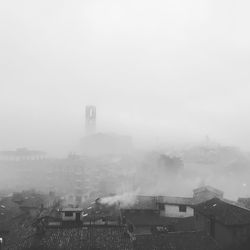 View of cityscape during foggy weather