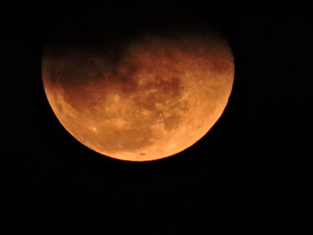 Low angle view of moon against sky at night