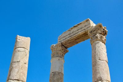 Low angle view of historical building against blue sky