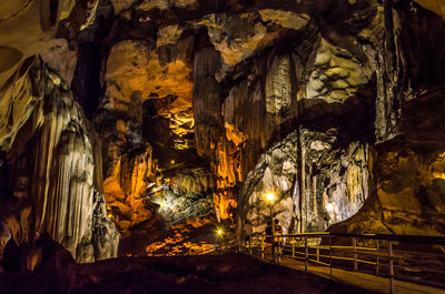 Low angle view of illuminated cave