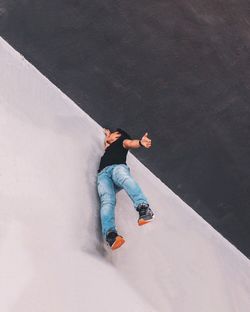 Low section of man standing on floor in city