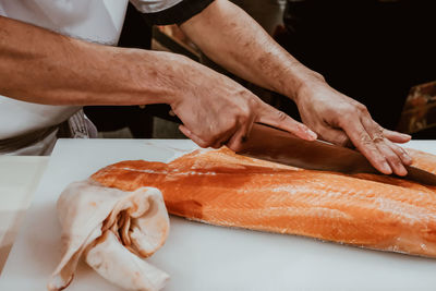 Close-up of man preparing food