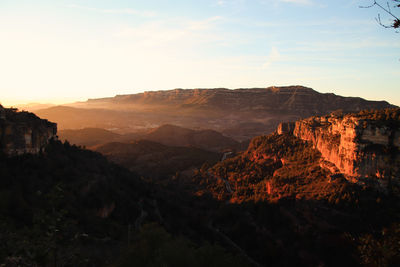 Scenic view of mountains against sky during sunset