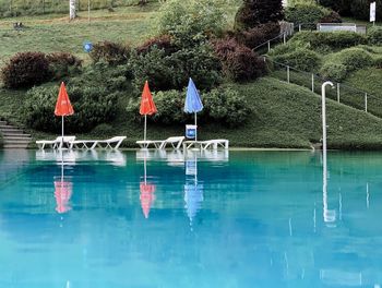 View of swimming pool against lake