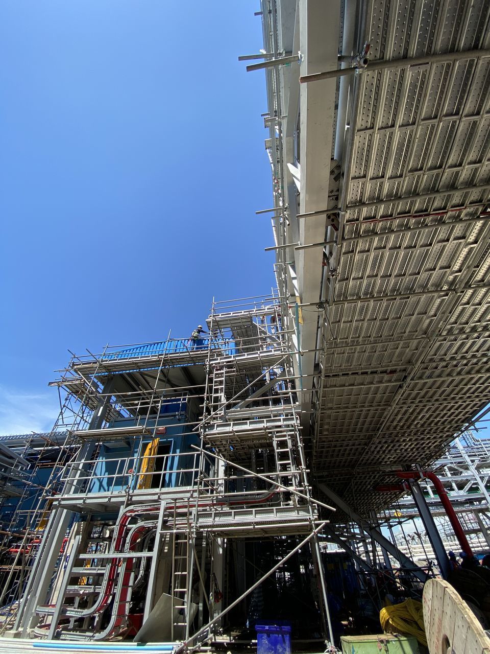 LOW ANGLE VIEW OF BUILDING UNDER CONSTRUCTION