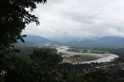 Scenic view of mountains against cloudy sky