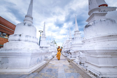 Woman walking outside temple