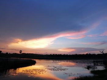 Scenic view of lake against sky during sunset