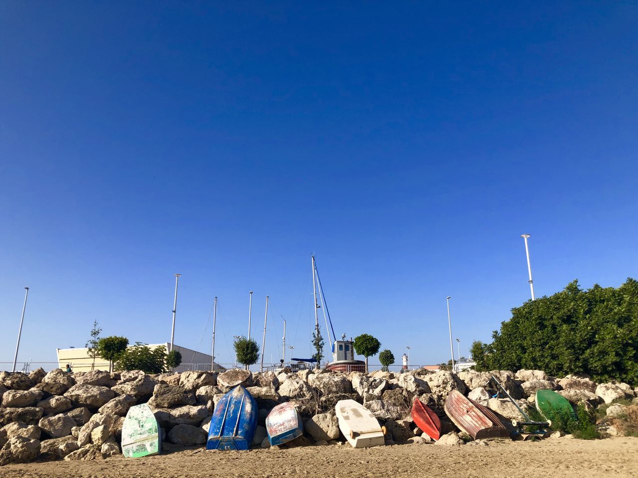 sky, sea, nature, blue, clear sky, large group of objects, no people, copy space, day, land, sunny, environment, outdoors, abundance, coast, beach, architecture, sunlight, water, transportation, built structure