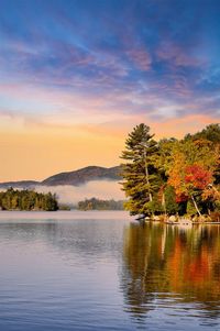 Scenic view of lake against sky during sunset