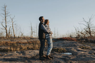 Young couple embracing during autumn hike