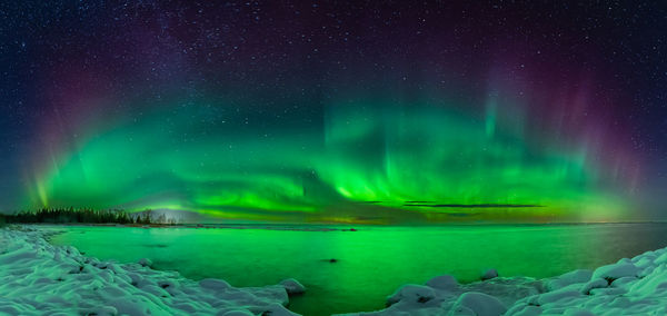 Scenic view of sea against sky at night