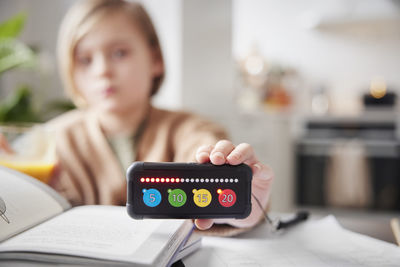 Child holding educational electronic game