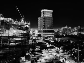 High angle view of illuminated buildings in city at night