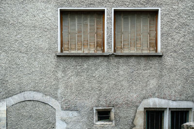 Low angle view of window on wall of building