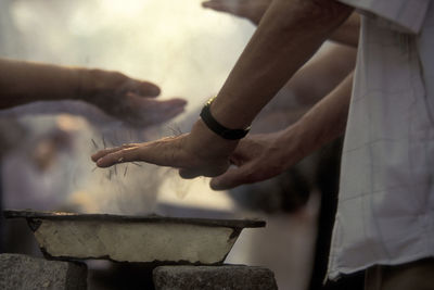 Cropped image of people getting acupuncture treatment