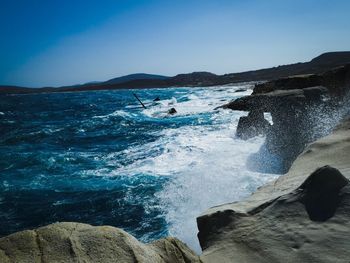 Scenic view of sea against clear blue sky