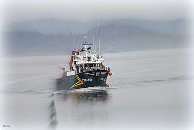 Boat in sea against sky