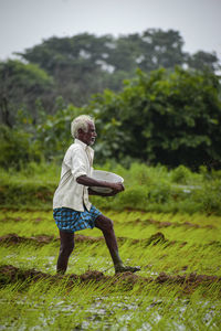 Side view of man on field