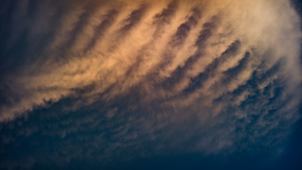 LOW ANGLE VIEW OF CLOUDSCAPE AGAINST SKY DURING SUNSET