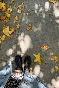 Low section of person standing on street