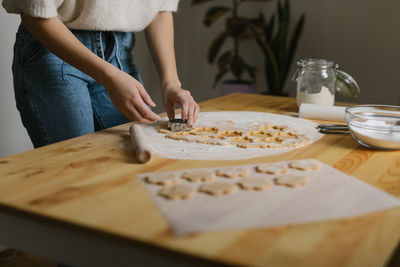 Young woman making christmas cookies