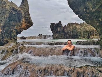 Full length of shirtless man in water