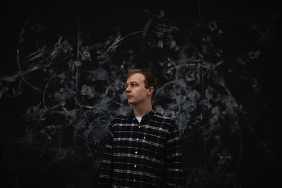 Portrait of young man looking away