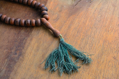 Close-up of rope tied on wooden table